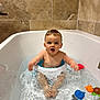 Paul participe au concours pour gagner de l'argent avec cette photo : baby, bathtub, bath_seat, splashing, water, bath_toys, tiled_wall, child, bathroom, blue_eyes, wet_hair, sitting, playful, skin, person, infant, fun, splash, happy, bath_time