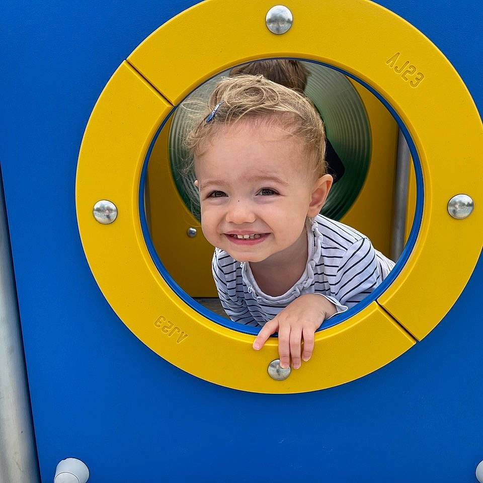 Yelena participe au concours pour gagner de l'argent avec cette photo : baby, baby_toddler_clothing, blue, child, chin, circle, electric_blue, eye, facial_expression, fun, happy, head, joy, organ, oval, person, playground, product, recreation, smile
