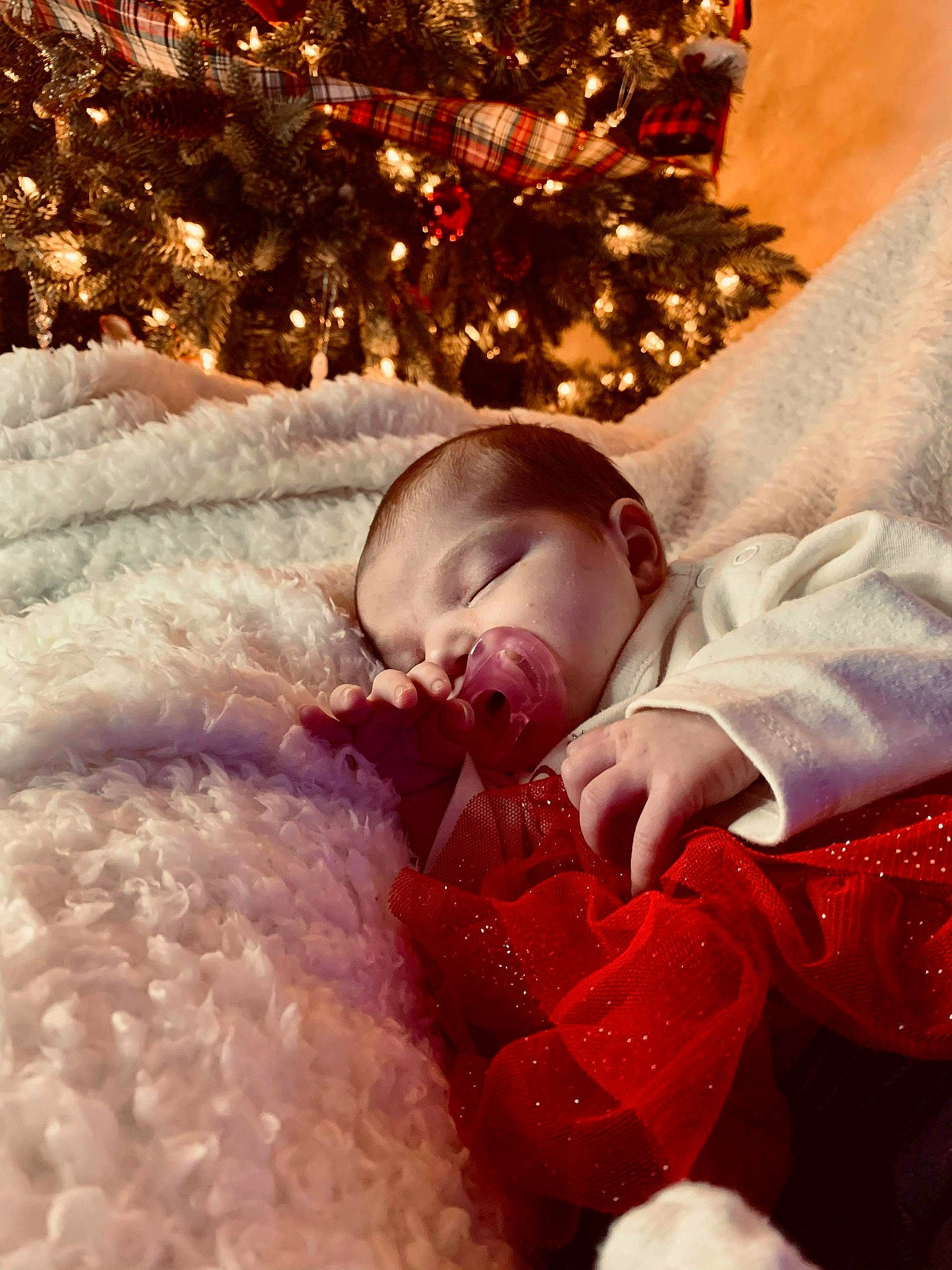 Lilanne joined the competition — help win amazing prizes! baby, baby_sleeping, baby_toddler_clothing, child, christmas, christmas_decoration, christmas_eve, christmas_lights, christmas_ornament, christmas_tree, comfort, conifer, event, holiday, holiday_ornament, interior_design, nail, ornament, person, red