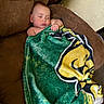 baby, sleeping, blanket, couch, brown, green, yellow, indoors, child, peaceful, resting, cozy, soft, infant, relaxation, comfort, home, portrait, wrapped, toddler