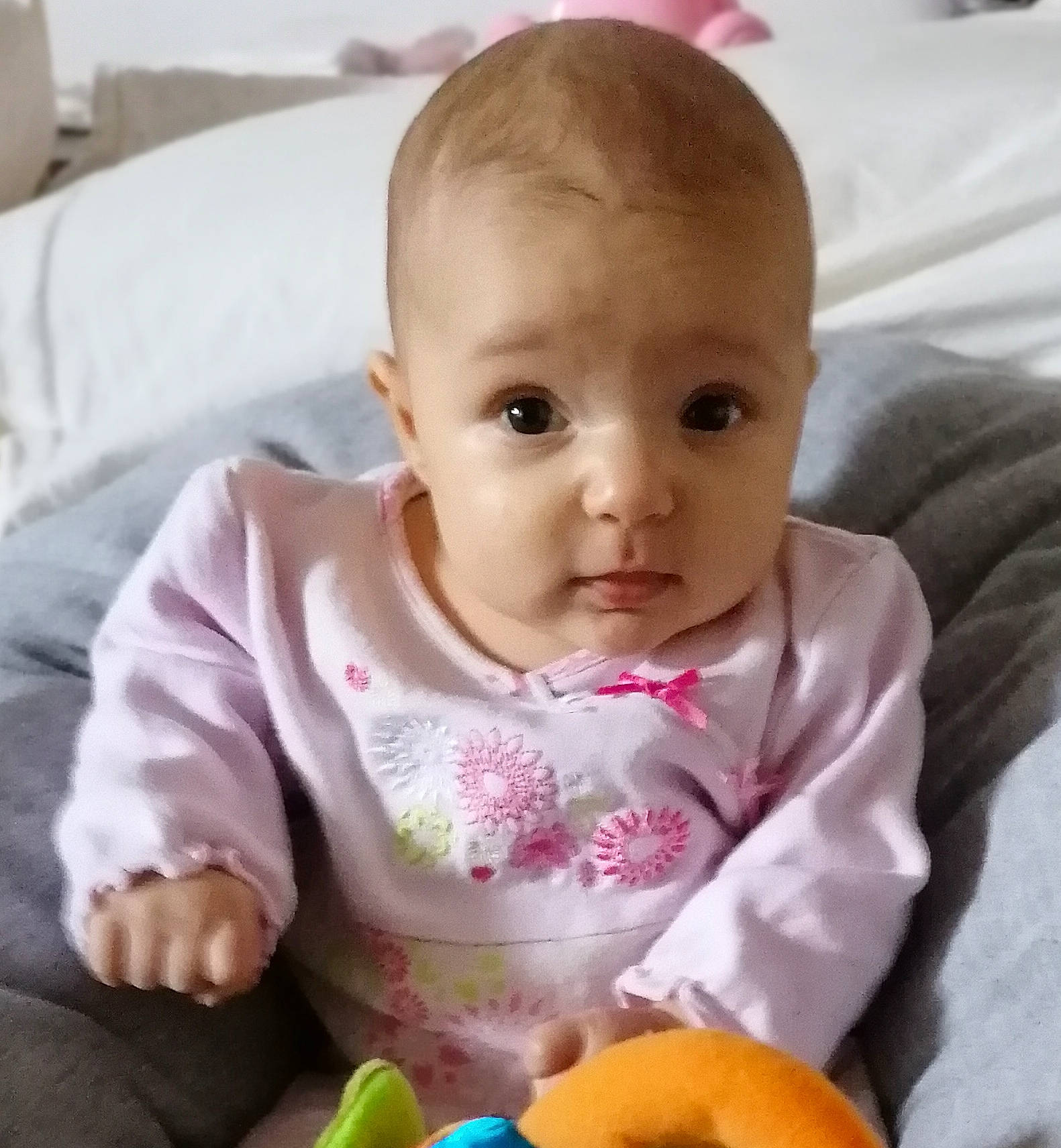 Milana participe au concours pour gagner de l'argent avec cette photo : baby, baby_products, cheek, child, eye, face, head, iris, lip, mouth, nose, person, play, product, sitting, skin, smile, toddler, tummy_time