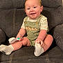 Adelio joined the competition — help win amazing prizes! toddler, child, smiling, indoor, chair, cushion, clothing, socks, hairbrush, person, cute, happy, seated, baby, overalls, green, white, skin, face, legs