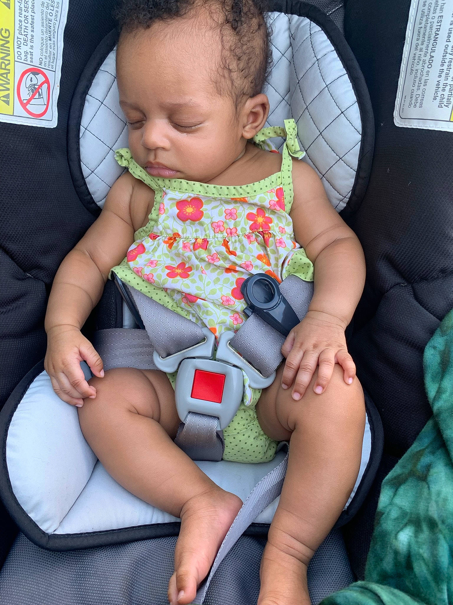 Mariah is registered to the contest to win money with this photo: arm, baby, baby_toddler_clothing, car_seat, cheek, child, comfort, face, finger, head, human_body, human_leg, knee, lap, leg, nail, person, skin, sock, thigh