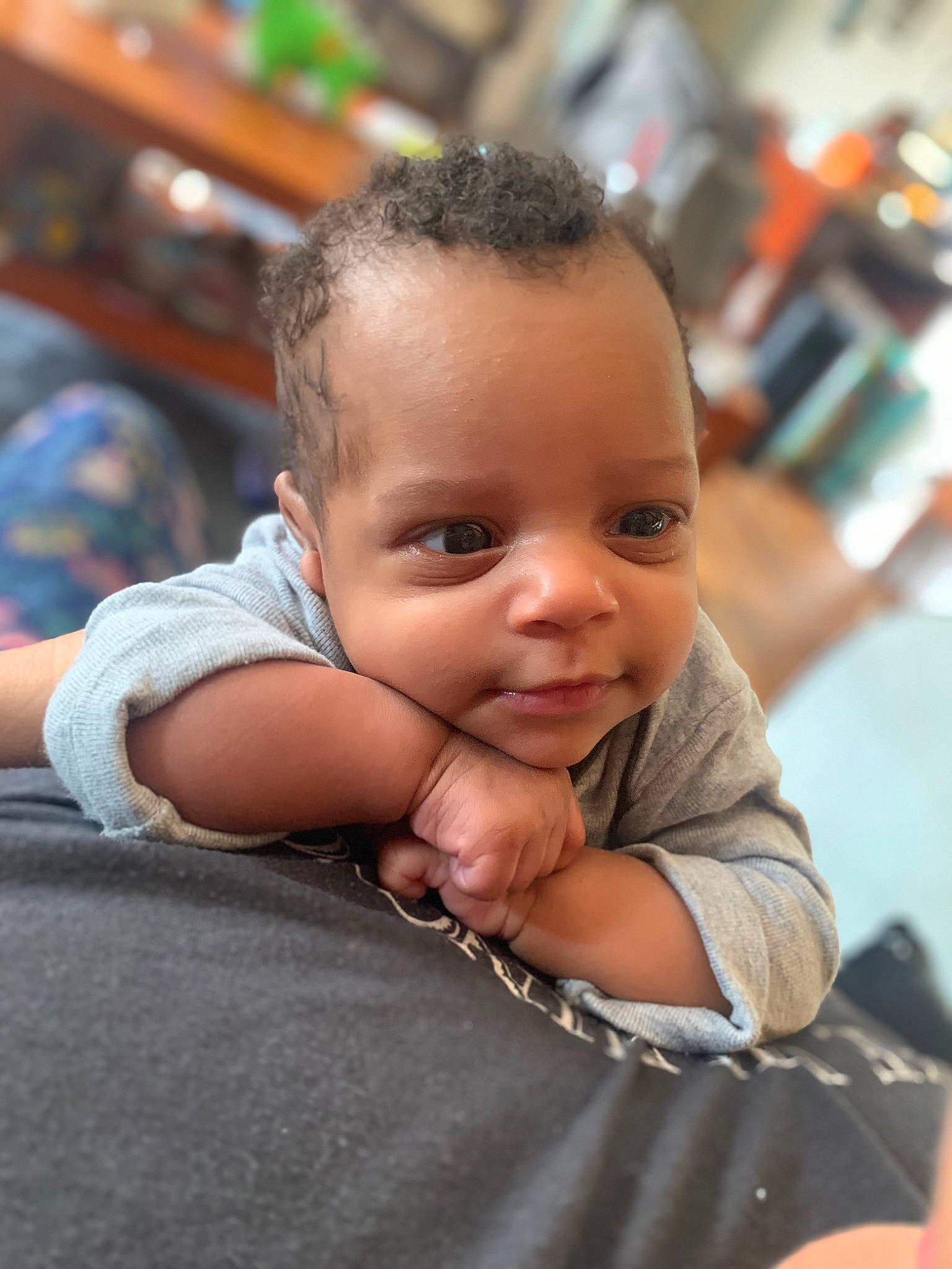 Mariah is registered to the contest to win money with this photo: baby, baby_toddler_clothing, cheek, child, ear, eyebrow, flooring, fun, gesture, hairstyle, hand, happy, head, iris, nose, person, sitting, skin, smile, thumb