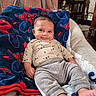 Michael joined the competition — help win amazing prizes! baby, smile, blanket, spiderman, chair, indoor, clothing, pants, sleeves, footwear, furniture, homedecor, babyclothes, person, infant, happy, cute, relaxing, portrait, cozy