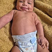 Michael is registered to the contest to win money with this photo: baby, diaper, smiling, lying_down, blanket, infant, child, skin, cute, happy, portrait, hand, face, young, newborn, expression, relaxed, indoors, toddler, person