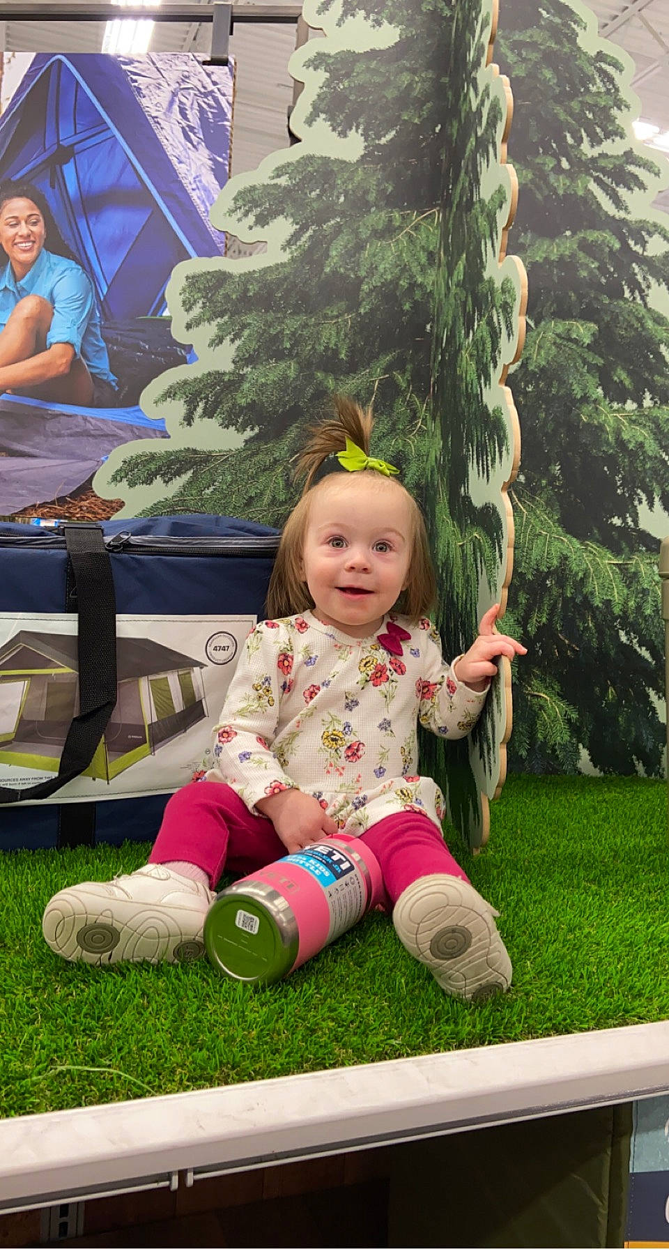 Everleigh is registered to the contest to win money with this photo: baby, baby_toddler_clothing, beauty, botany, child, conifer, event, evergreen, fun, garden, grass, happy, joy, leaf, leisure, people_in_nature, person, plant, sitting, smile