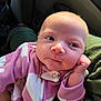 Alexis joined the competition — help win amazing prizes! baby, infant, newborn, child, pink_onesie, fleece, blanket, portrait, face, eyes, hand, cheek, forehead, nose, mouth, car_interior, seat, cozy, soft_texture, close_up