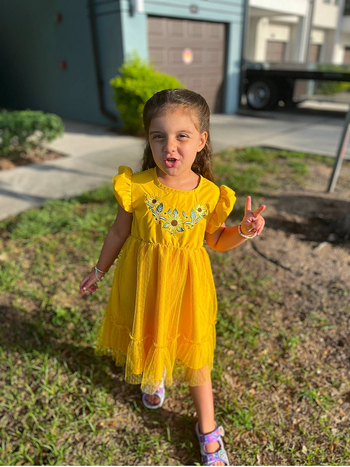 Nadia is registered to the contest to win money with this photo: baby_toddler_clothing, child, costume, event, face, fun, garden, grass, happy, leisure, magenta, people_in_nature, person, plant, pumpkin, recreation, sandal, t_shirt, toddler, truck