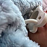 Brayden is registered to the contest to win money with this photo: baby, infant, pacifier, blanket, fluffy, blue, sleeping, cozy, close_up, portrait, nursery, soft, textile, bedding, snuggling, indoors, comfort, child, pastel, peaceful