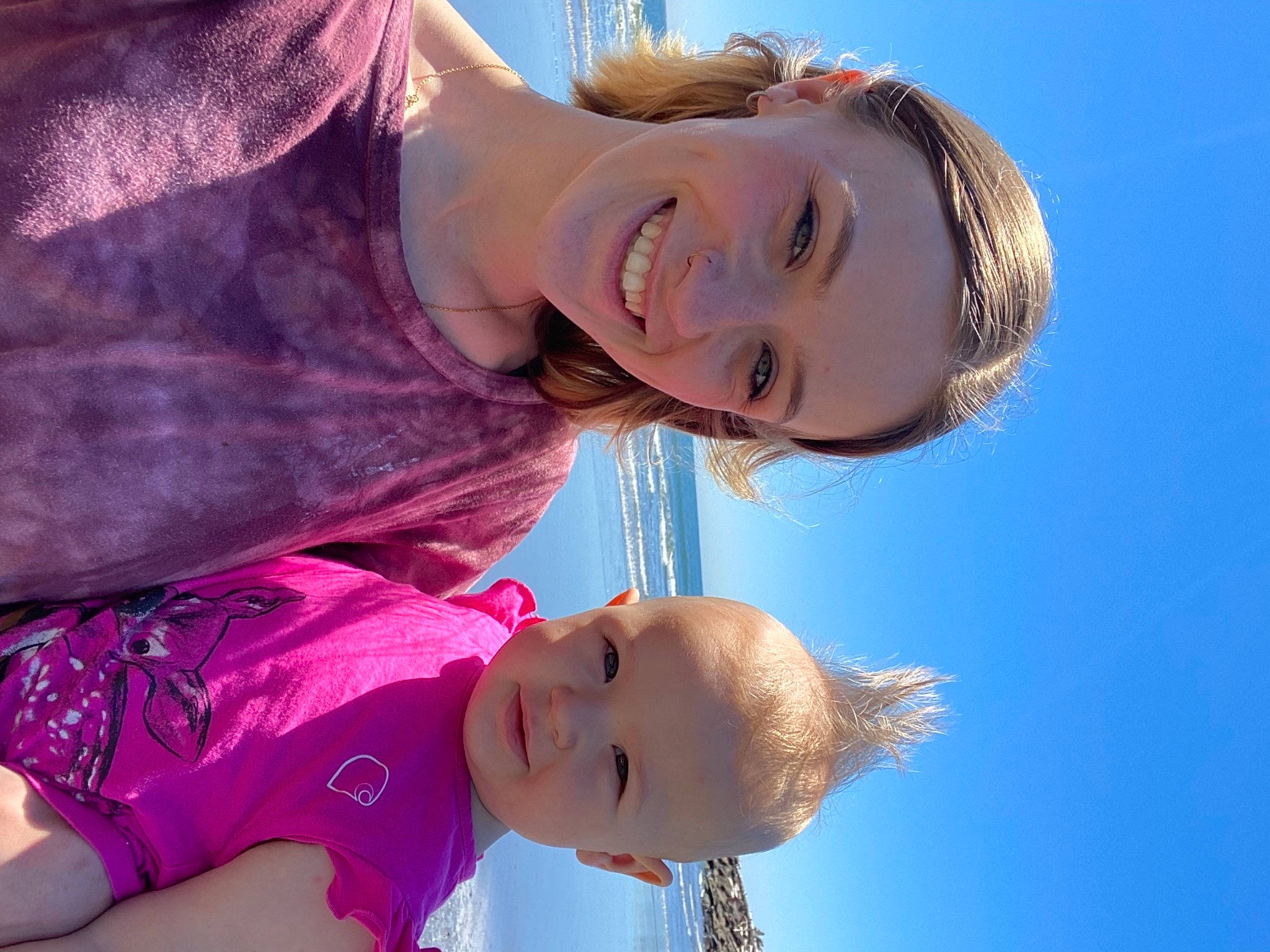 Faye is registered to the contest to win money with this photo: face, gesture, happy, head, human, joy, light, lip, mouth, neck, nose, people_in_nature, person, photograph, pink, skin, sky, smile, sunlight, toddler