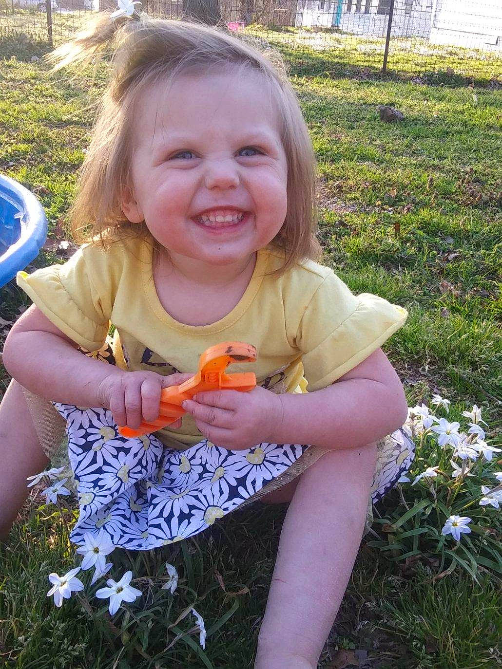 Aryana is registered to the contest to win money with this photo: child, fawn, flower, fun, grass, iris, joy, person, plant, smile, spring, summer, toddler, wildflower