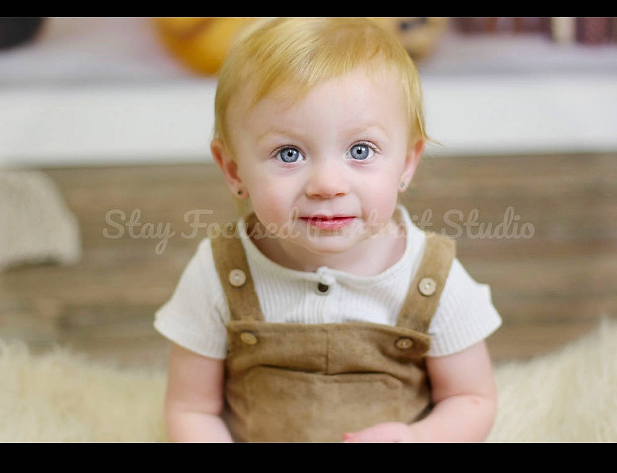 Kalleigh is registered to the contest to win money with this photo: baby, baby_toddler_clothing, blond, cheek, child, collar, dress, eye, eyelash, flash_photography, gesture, happy, iris, nose, person, sitting, skin, sleeve, t_shirt, toddler