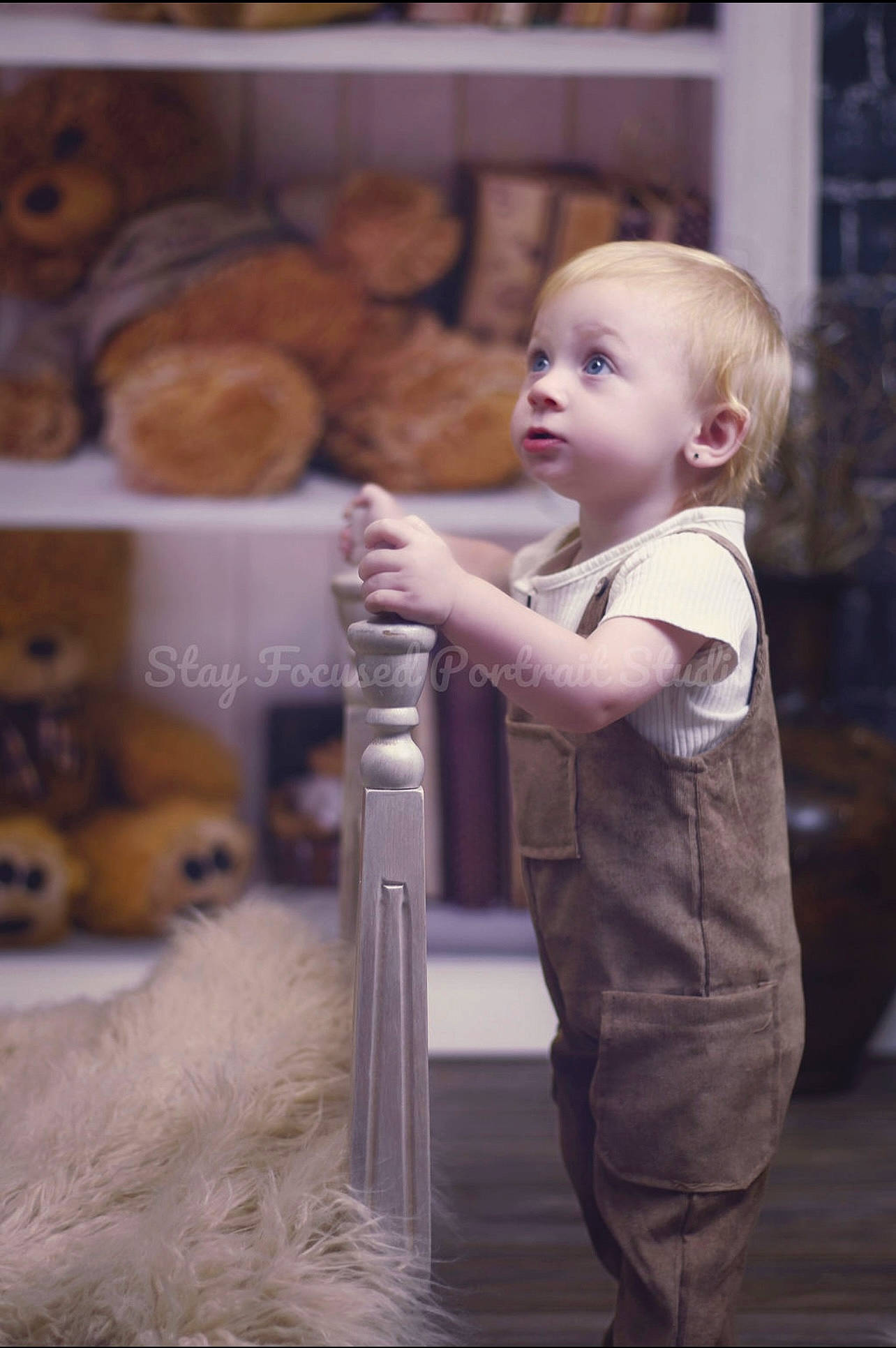 Kalleigh is registered to the contest to win money with this photo: baby, child, flooring, fun, fur, happy, ingredient, livestock, person, portrait_photography, sitting, surprise, t_shirt, toddler, vegetable, wood