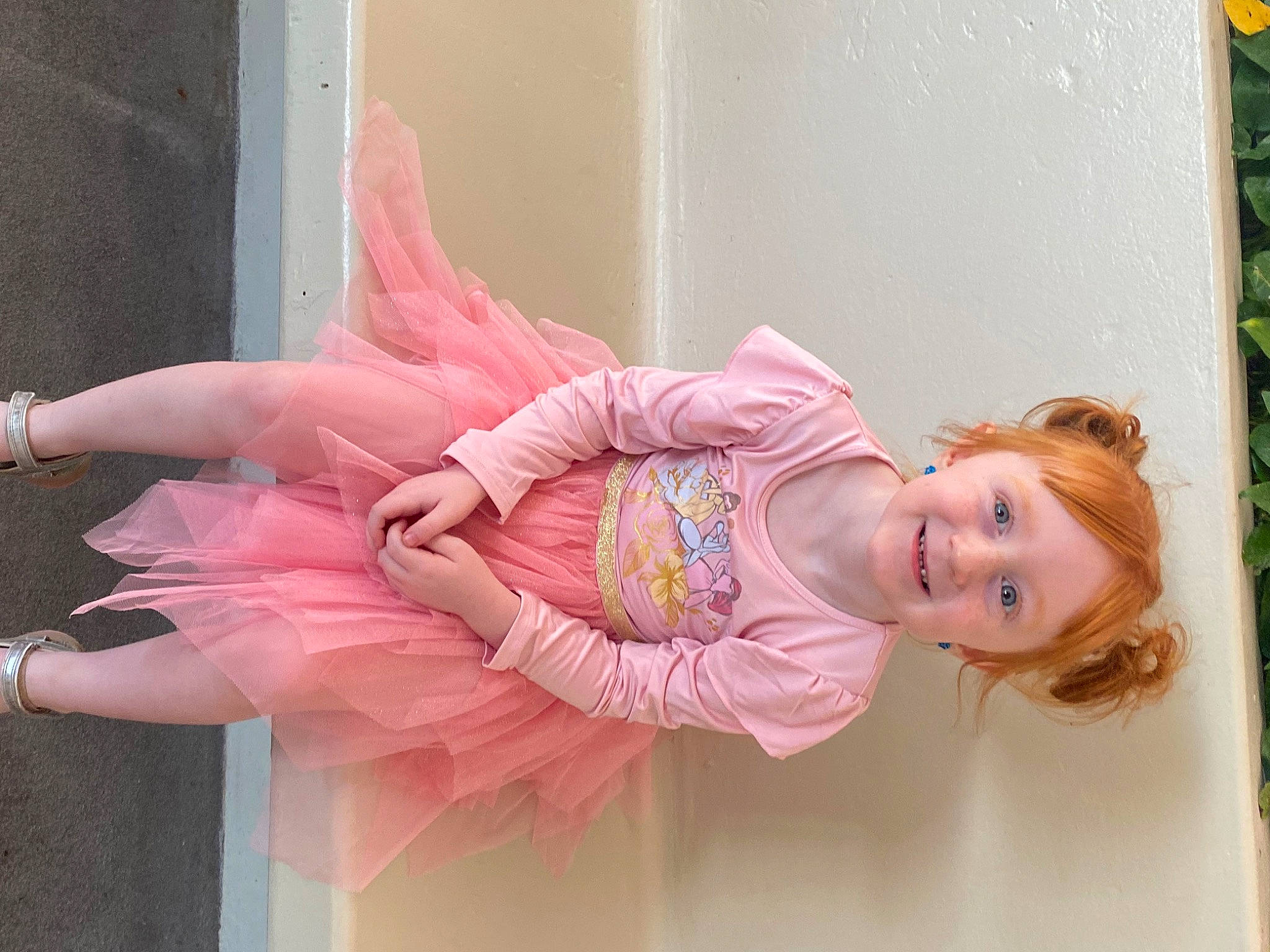 Isabelle is registered to the contest to win money with this photo: baby_toddler_clothing, ballet_tutu, child, dress, entertainment, event, fashion_accessory, fashion_design, fun, happy, headpiece, human_leg, joy, magenta, peach, performing_arts, person, pink, ruffle, smile