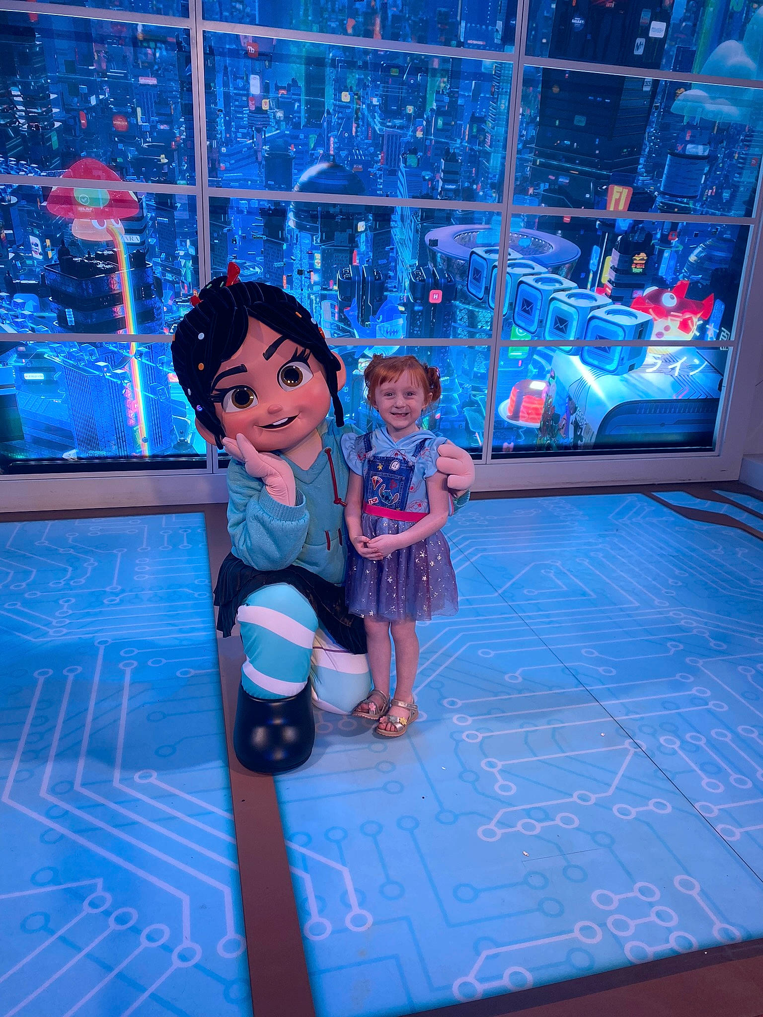 Isabelle is registered to the contest to win money with this photo: blue, boot, dress, electric_blue, entertainment, event, fashion, fictional_character, flooring, fun, hat, joy, leisure, magenta, person, purple, recreation, smile, standing, technology