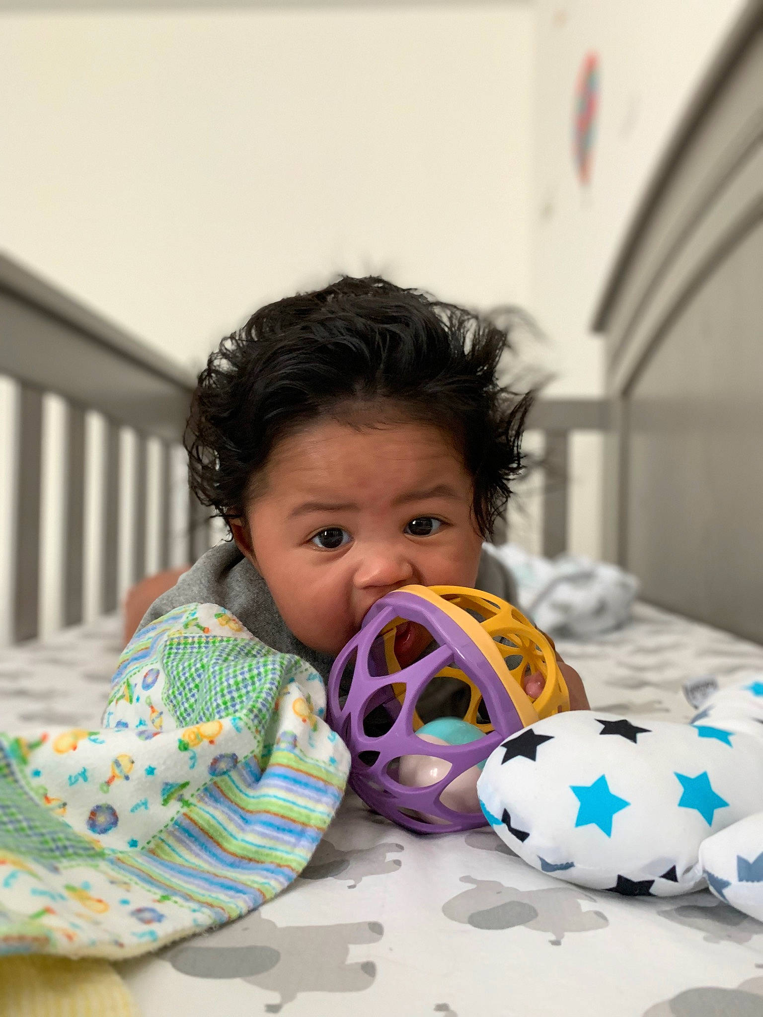 Ren is registered to the contest to win money with this photo: baby, baby_products, baby_toddler_clothing, baby_toys, ball, child, comfort, eyelash, fun, happy, leisure, linens, pattern, person, personal_protective_equipment, plastic, play, recreation, room, toddler