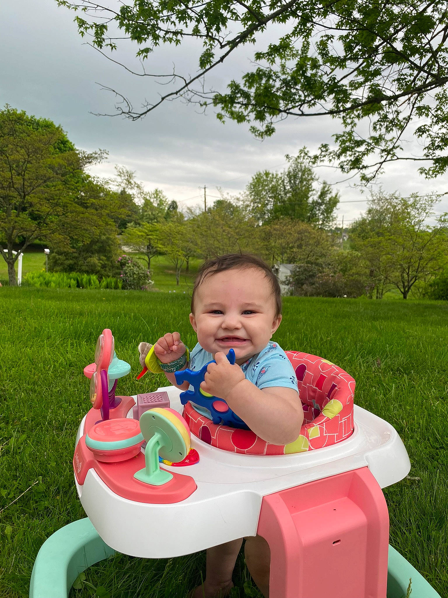Octavia is registered to the contest to win money with this photo: baby_toddler_clothing, child, cloud, fun, grass, green, happy, joy, leisure, nature, outdoor_furniture, people_in_nature, person, plant, recreation, sharing, sky, summer, table, tableware