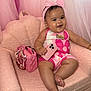 baby, pink, chair, handbag, phone, headband, jewelry, smile, happy, infant, portrait, couch, fashion, accessory, furniture, child, indoors, cute, plush, person