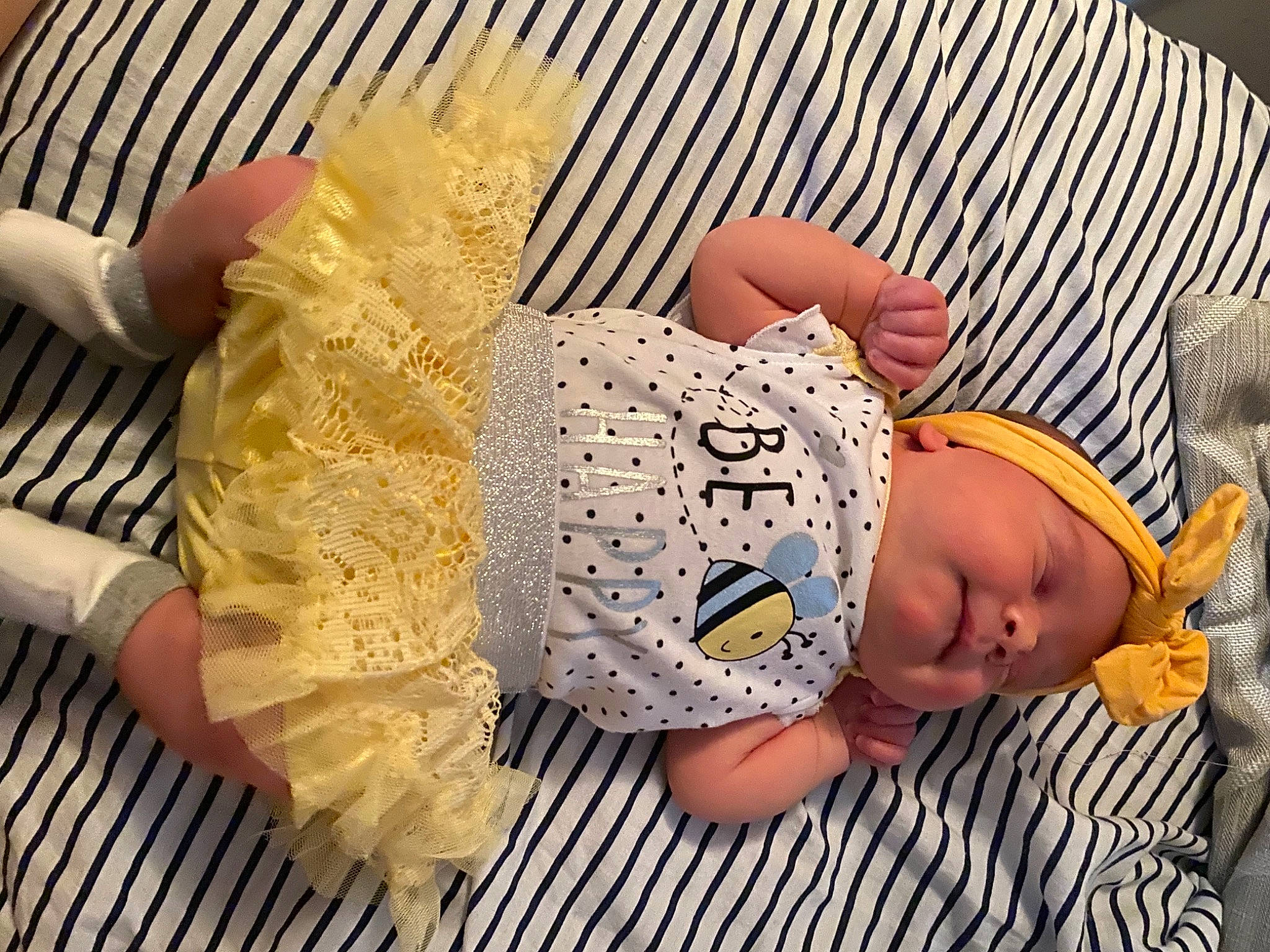 Hailey joined the competition — help win amazing prizes! baby, baby_products, baby_sleeping, baby_toddler_clothing, child, comfort, comfort_food, fashion_accessory, foot, fur, headwear, knitting, nail, pattern, person, sitting, thread, thumb, toddler, wood