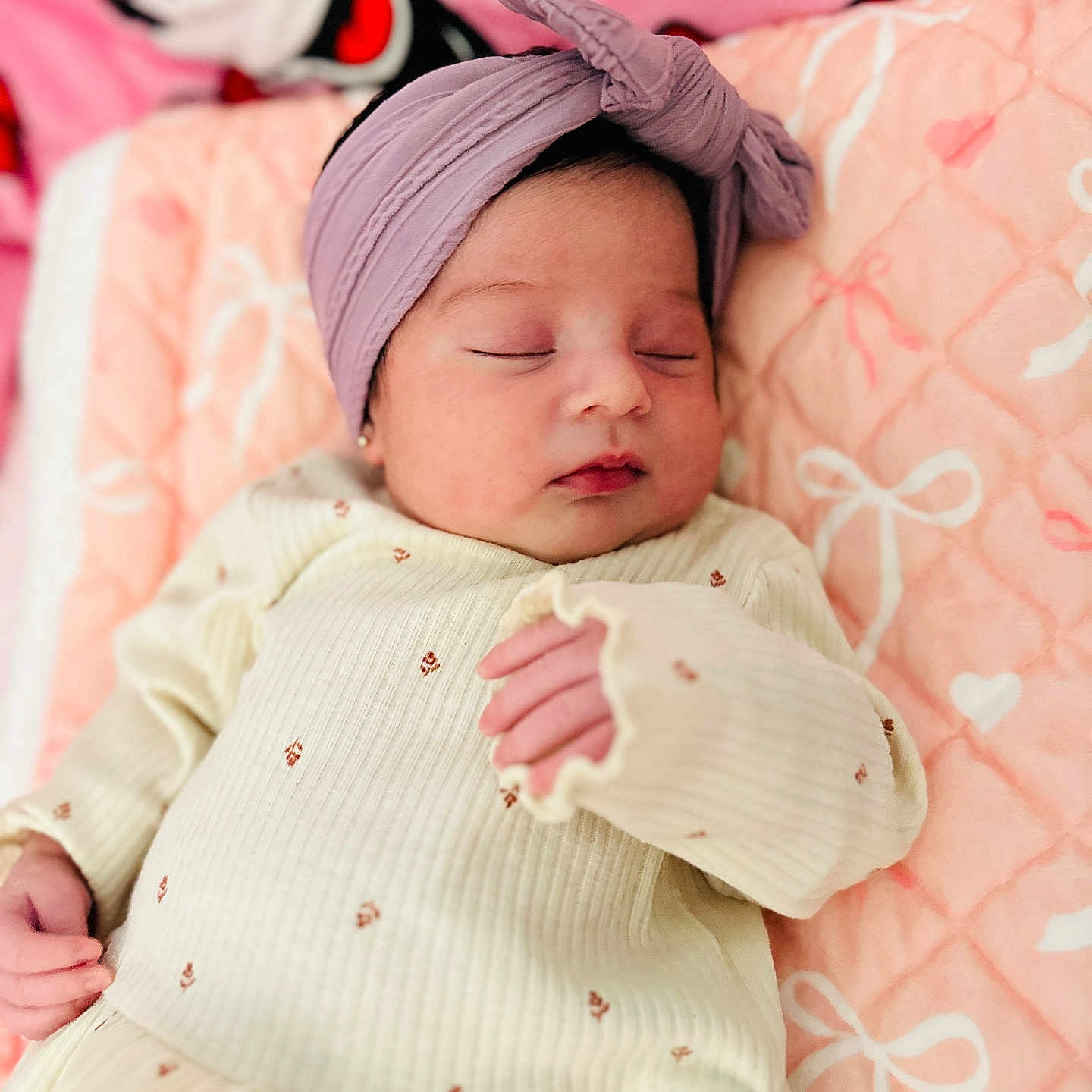 Madison Magaly is registered to the contest to win money with this photo: newborn, baby, sleeping, infant, portrait, headband, pink, blanket, bed, bedding, clothing, onesie, hands, face, closed_eyes, peaceful, indoors, nursery, cozy, photography