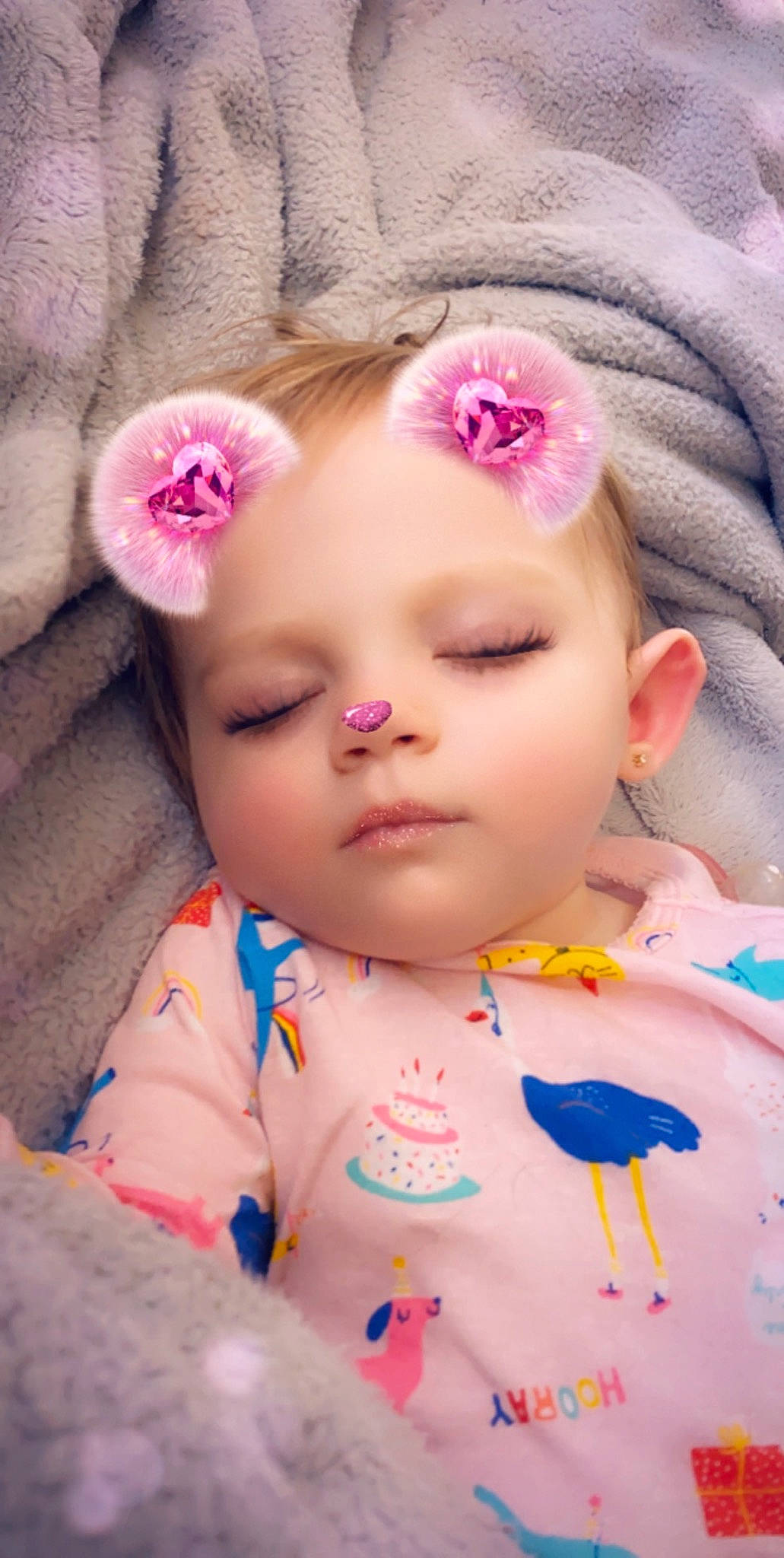 Lorelai is registered to the contest to win money with this photo: baby, cheek, child, close_up, doll, eye, eyebrow, eyelash, face, forehead, hair_accessory, head, headwear, iris, lip, mouth, nose, person, pink, skin