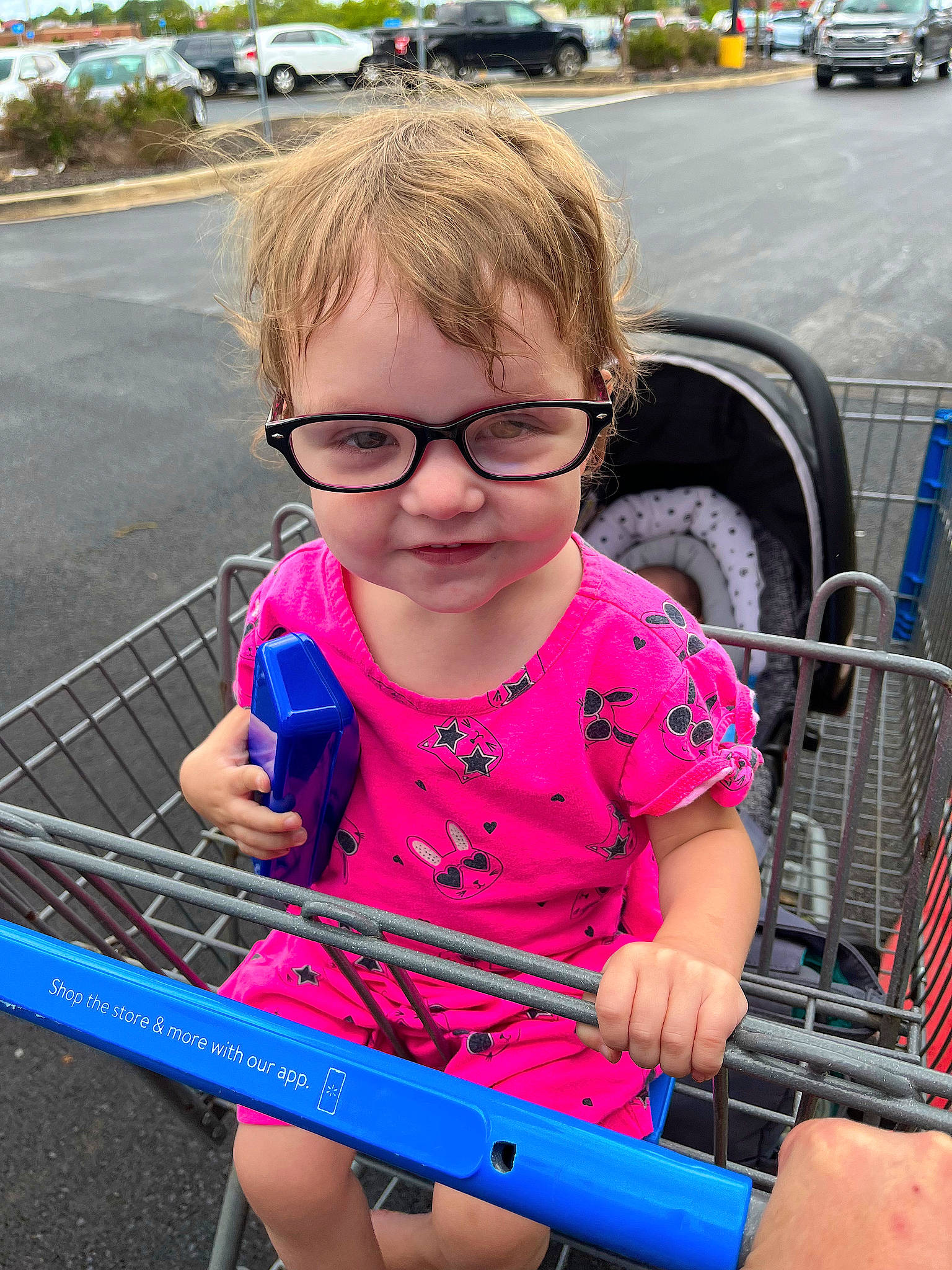 Lilly joined the competition — help win amazing prizes! automotive_tire, car, child, eyewear, fun, glasses, leisure, people, person, photograph, product, public_space, smile, snapshot, summer, sunglasses, tire, toddler, vehicle, vision_care