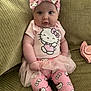 baby, infant, hello_kitty, pink_bow, pink_clothing, tutu, headband, cute, portrait, indoor, couch, child, smiling, fashion, toddler, person, sitting, adorable, young_child, casual