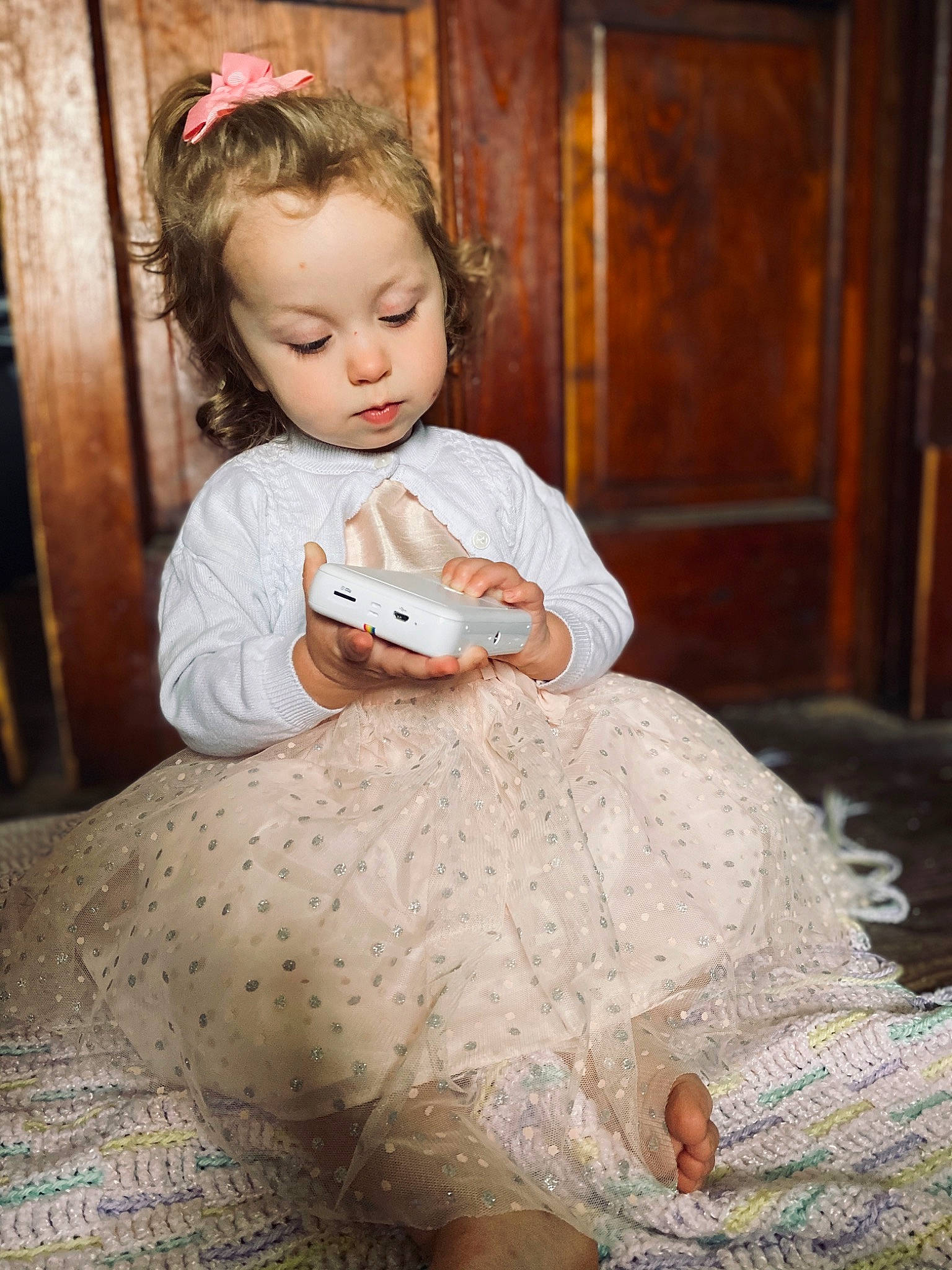 Nora Jean is registered to the contest to win money with this photo: baby, child, child_model, dress, hair_accessory, person, photograph, portrait, portrait_photography, sitting, skin, sleeve, toddler