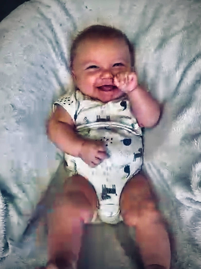 Briley is registered to the contest to win money with this photo: arm, baby, baby_toddler_clothing, cheek, comfort, cool, finger, flash_photography, fun, happy, human, human_body, iris, mouth, organ, people, person, skin, sleeve, smile