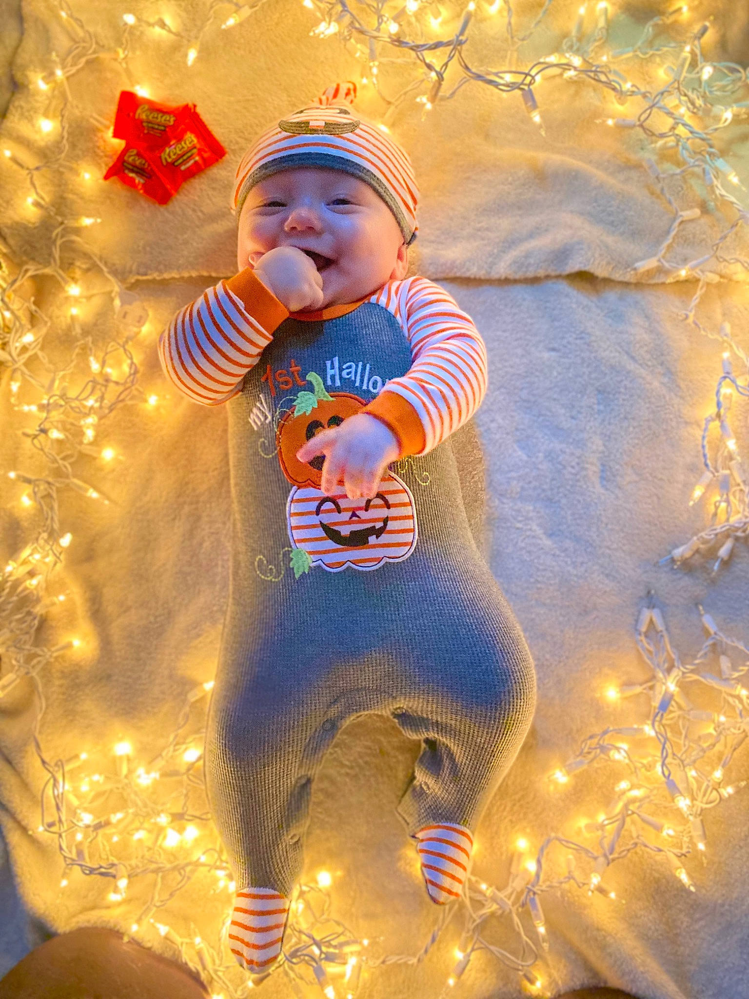 Briley is registered to the contest to win money with this photo: art, baby, baby_toddler_clothing, child, christmas, christmas_decoration, christmas_eve, christmas_ornament, event, fictional_character, fun, happy, headwear, holiday, light, ornament, people_in_nature, person, sand, toddler