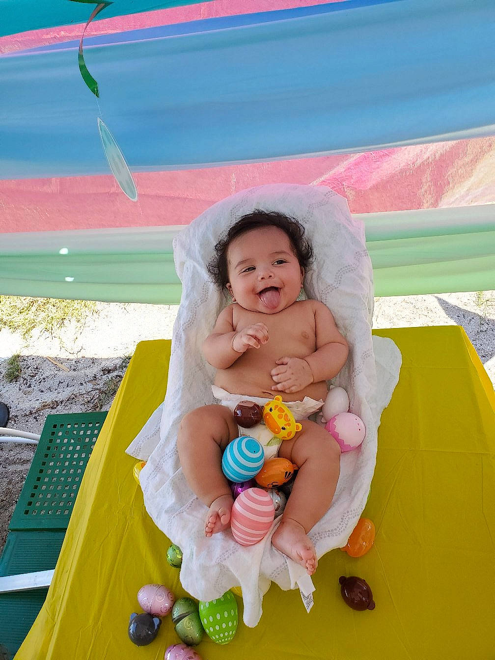 Dominick is registered to the contest to win money with this photo: abdomen, baby, baby_products, barefoot, child, event, fun, games, grass, happy, leisure, person, play, recreation, sitting, stuffed_toy, tent, textile, toddler, toy