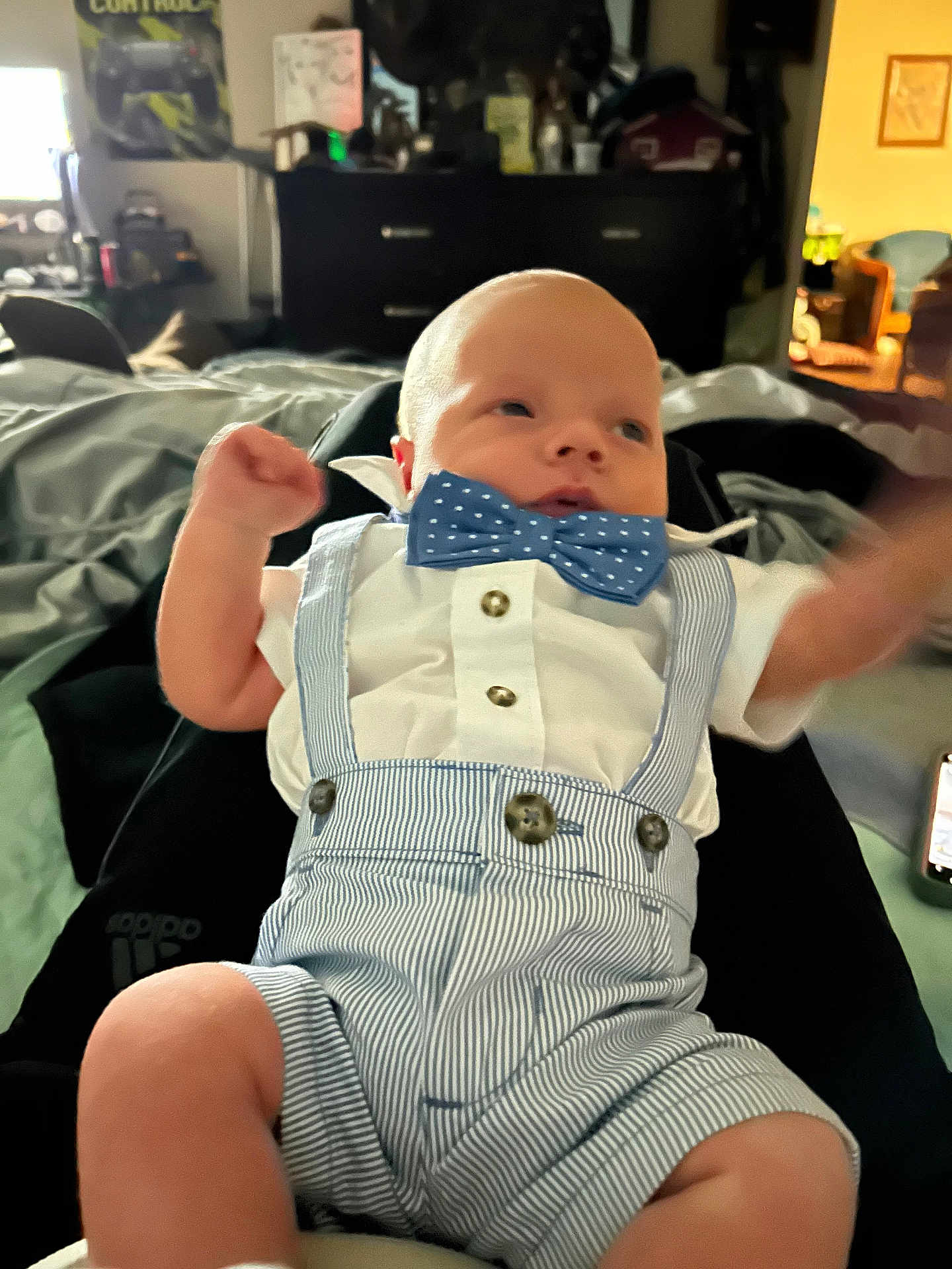 Jacob joined the competition — help win amazing prizes! baby, infant, bowtie, striped_clothing, white_shirt, blue, cute, arms_up, indoor, person, legs, blurred_motion, furniture, dresser, room, casual, portrait, newborn, clothing, home