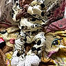 baby, child, infant, mickey_mouse, clothing, blanket, pillow, patterned, cute, cozy, indoors, face, hands, feet, shoes, white, black, yellow, pink, smiling