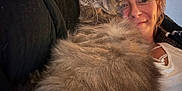 Boosie is registered to the contest to win money with this photo: cat, woman, couch, fluffy, smiling, cozy, indoor, pet, relaxed, closeup, feline, happy, casual, portrait, comfort, snuggling, hair, clothing, face, home