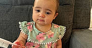 Ariella joined the competition — help win amazing prizes! arm, baby, brush, casual, child, clothing, couch, cute, expression, face, floral_pattern, furniture, hair_clip, home, indoor, leg, person, sitting, skin, toddler
