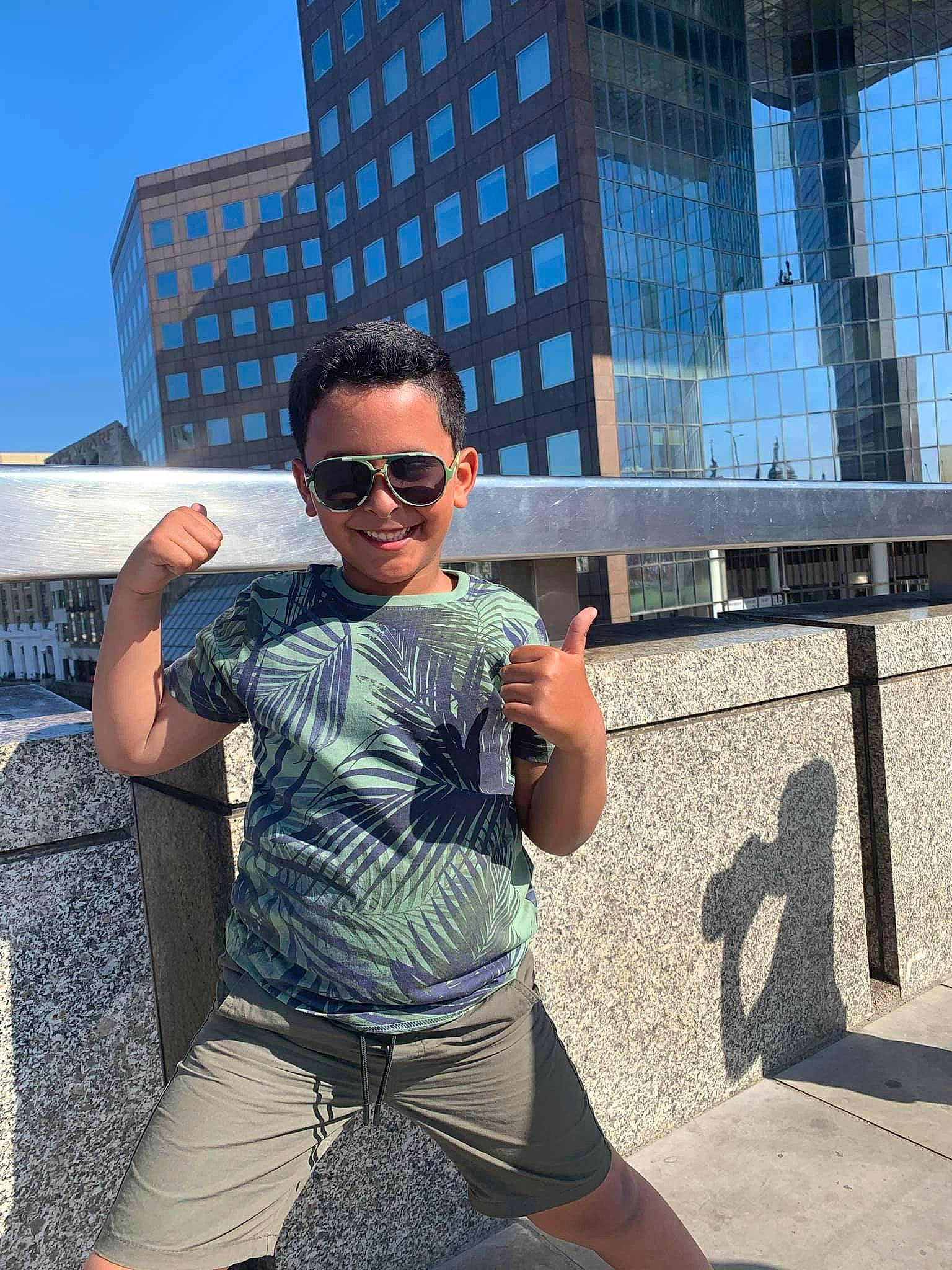 Ibrahim joined the competition — help win amazing prizes! azure, building, city, cool, electric_blue, eyewear, glasses, goggles, human_leg, joy, leisure, person, shoulder, sky, street_fashion, sunglasses, thigh, travel, trunk, vision_care