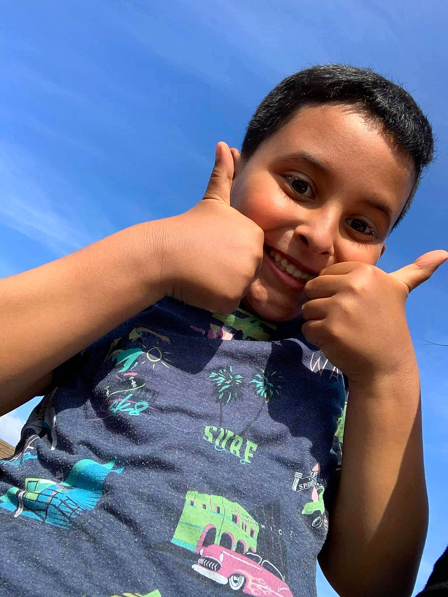 Ibrahim is registered to the contest to win money with this photo: azure, black_hair, cool, electric_blue, finger, flash_photography, forehead, fun, gesture, hand, happy, joy, leisure, lip, neck, people_in_nature, person, sky, sleeve, smile