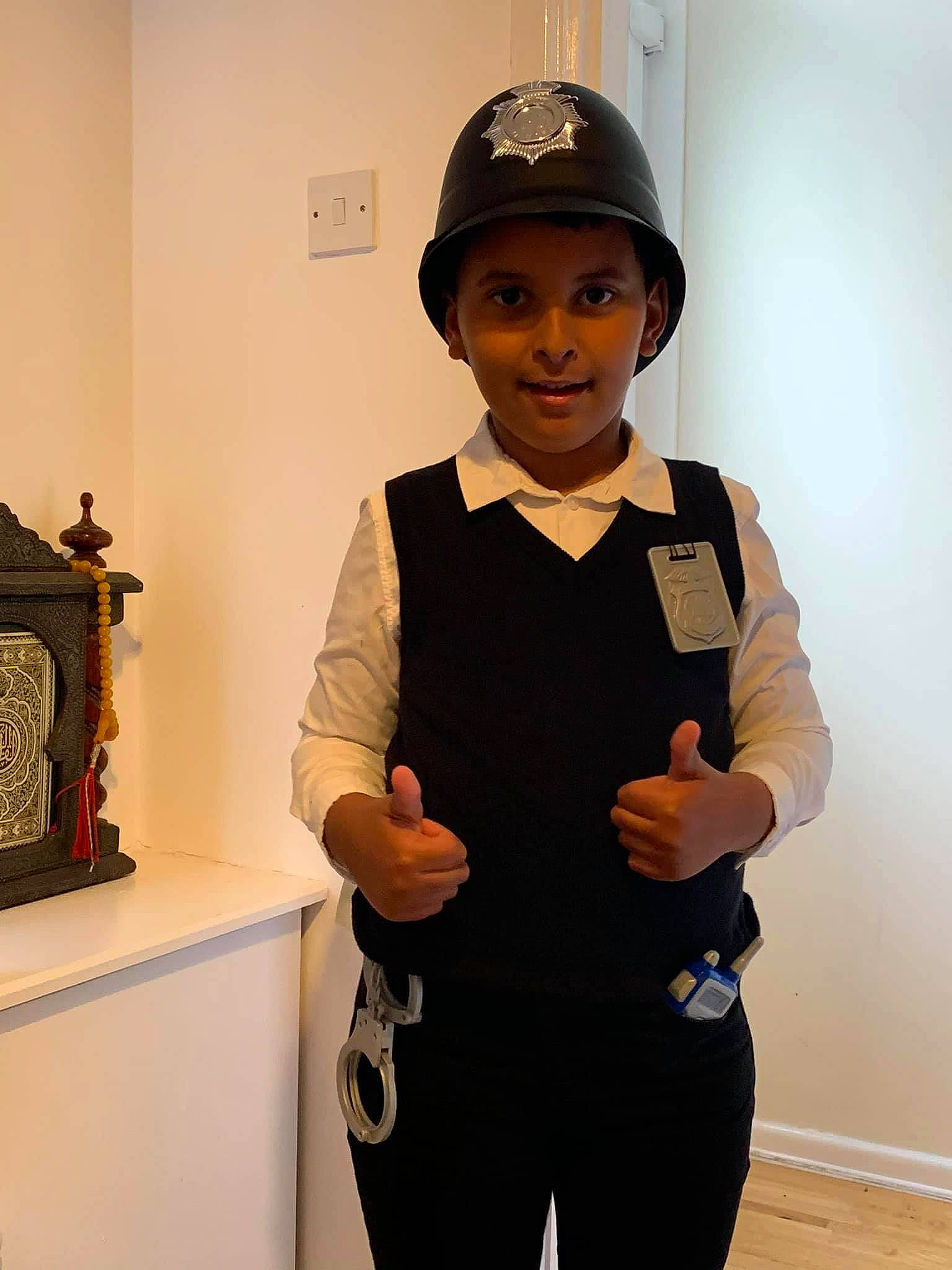 Ibrahim is registered to the contest to win money with this photo: baseball_cap, belt, black, blazer, button, cap, collar, dress_shirt, electric_blue, event, eyewear, fashion_design, formal_wear, gesture, hat, headwear, joy, person, sleeve, smile