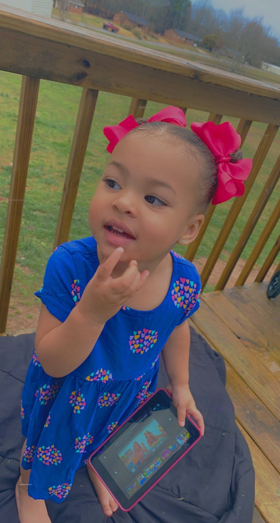 Journee is registered to the contest to win money with this photo: baby, baby_toddler_clothing, child, electric_blue, fashion_accessory, fun, grass, hair_accessory, happy, jewellery, leisure, magenta, pattern, person, play, sitting, skin, t_shirt, tablet_computer, toddler