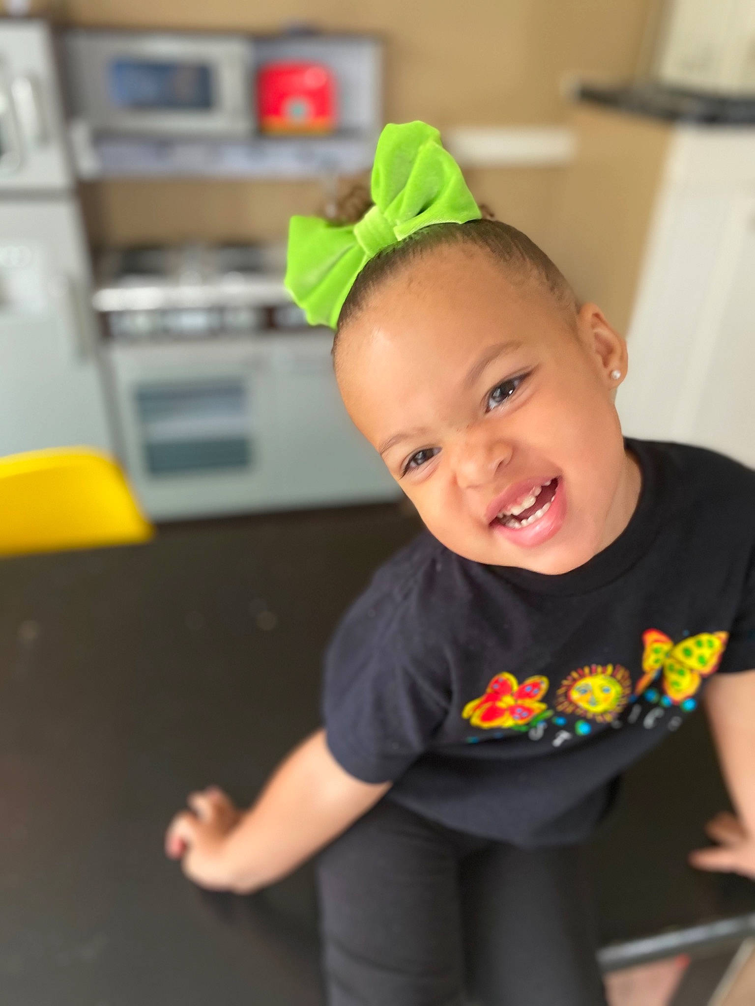 Journee joined the competition — help win amazing prizes! baby, child, costume, costume_hat, event, eye, flooring, fun, happy, human_body, party, party_supply, person, plant, play, room, sitting, sleeve, smile, t_shirt