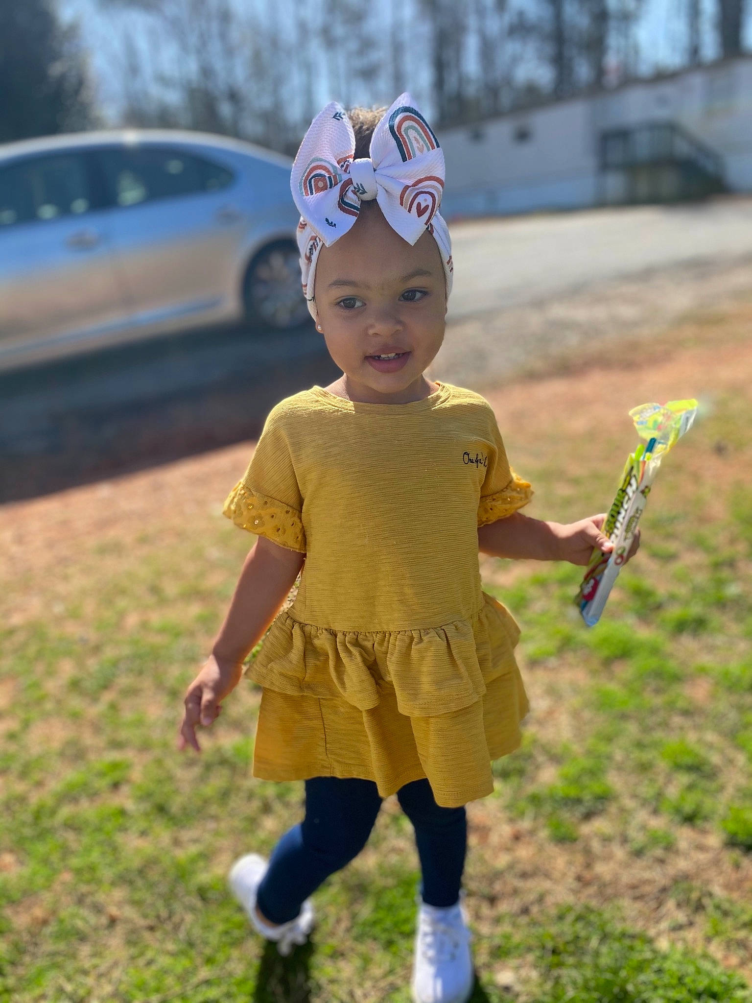 Journee is registered to the contest to win money with this photo: baby, cap, car, child, fun, grass, hair, happy, hat, headwear, leisure, person, racket, recreation, shoe, smile, sneakers, sock, sports_equipment, street_fashion