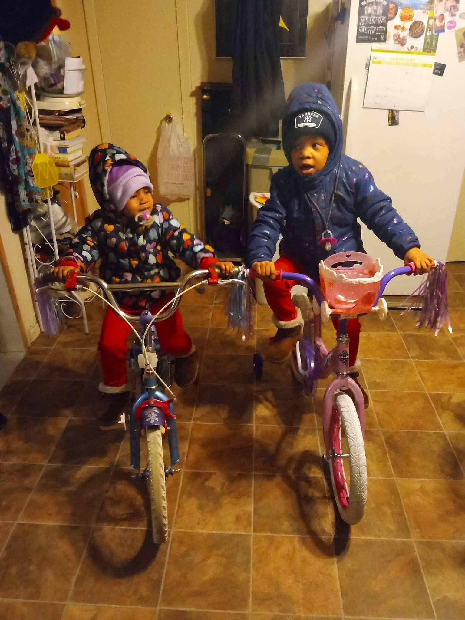 Bella is registered to the contest to win money with this photo: automotive_tire, bicycle, bicycle_accessory, bicycle_fork, bicycle_frame, bicycle_handlebar, bicycle_helmet, bicycle_part, bicycle_saddle, bicycle_tire, bicycle_wheel, bicycles_equipment_and_supplies, crankset, headwear, helmet, land_vehicle, person, sports_equipment, tire, toddler