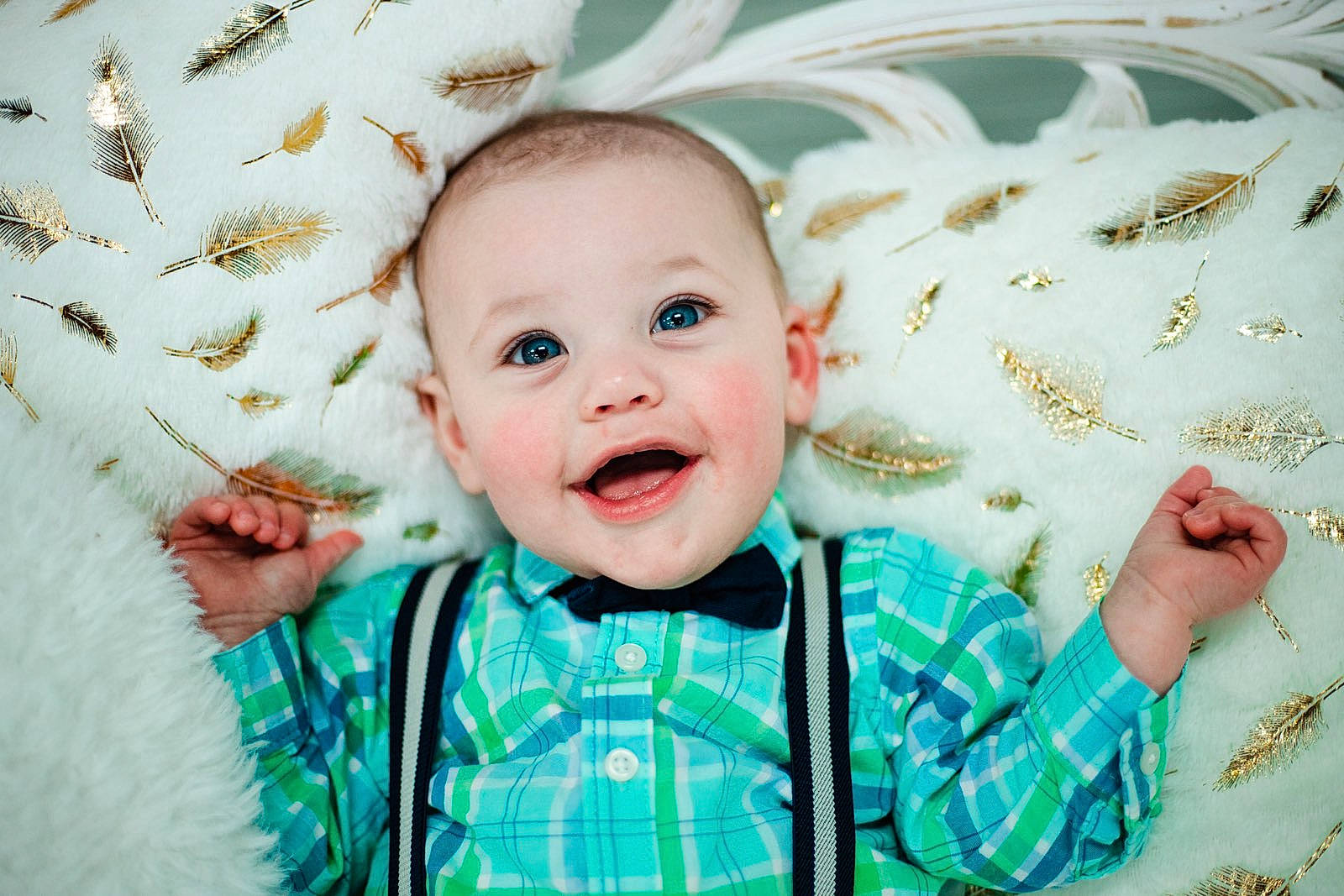Iverson is registered to the contest to win money with this photo: baby, baby_toddler_clothing, cheek, child, eye, face, fun, gesture, grass, happy, head, linens, pattern, people_in_nature, person, product, skin, sleeve, smile, t_shirt