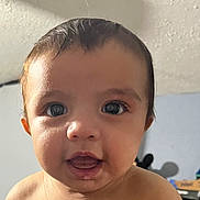 Nikolyjah is registered to the contest to win money with this photo: baby, child, face, head, skin, eyes, mouth, expression, indoor, ceiling, wall, curly_hair, portrait, closeup, person, infant, cute, looking, young, human