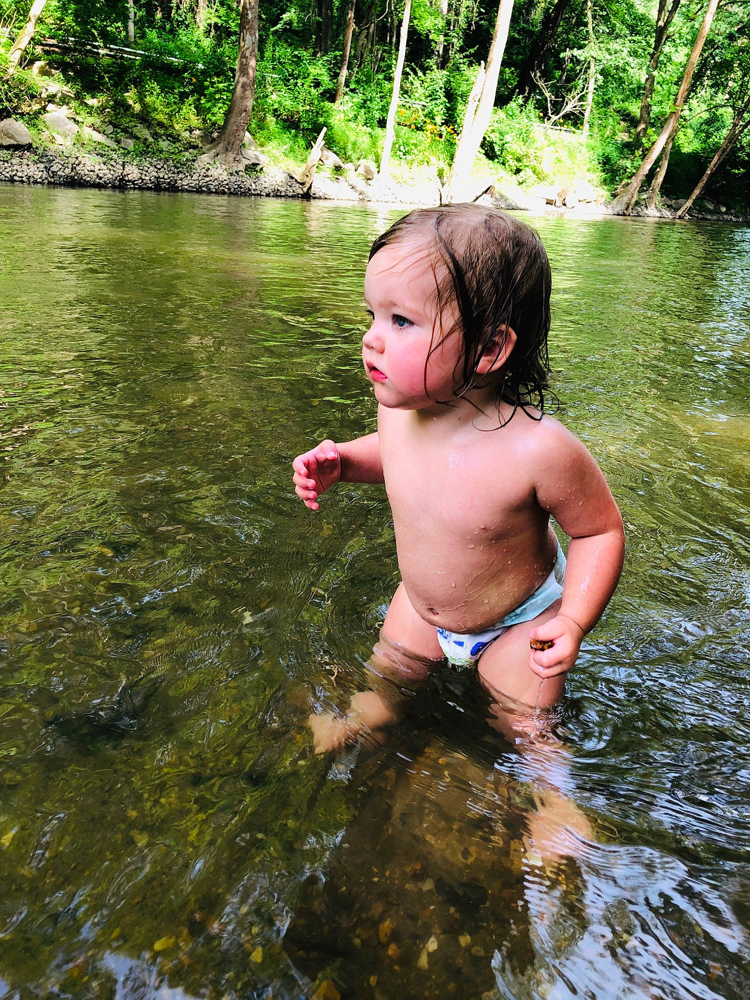Elle is registered to the contest to win money with this photo: bank, bathing, child, creek, fun, leisure, person, photography, plant, play, pond, recreation, river, smile, stream, summer, tree, vacation, water, water_resources