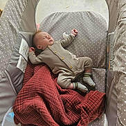 Thomas is registered to the contest to win money with this photo: baby, sleeping, crib, blanket, onesie, socks, infant, resting, cozy, soft, fabric, pattern, star_pattern, indoor, child, peaceful, cute, young, bed, nap