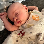 Valerie joined the competition — help win amazing prizes! newborn, baby, sleeping, infant, face, portrait, blanket, swaddle, onesie, clothing, lying_down, indoors, cozy, peaceful, relaxed, closed_eyes, raised_arm, bedding, textile, photography