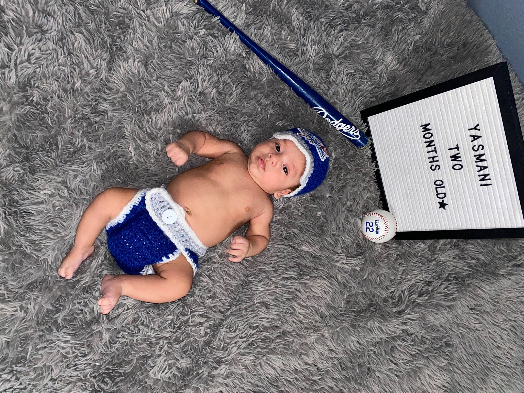 Yasmani joined the competition — help win amazing prizes! baby, barefoot, child, elbow, electric_blue, flooring, foot, fun, grass, headwear, human_leg, knee, leisure, people_in_nature, person, recreation, soil, swimwear, t_shirt, thigh