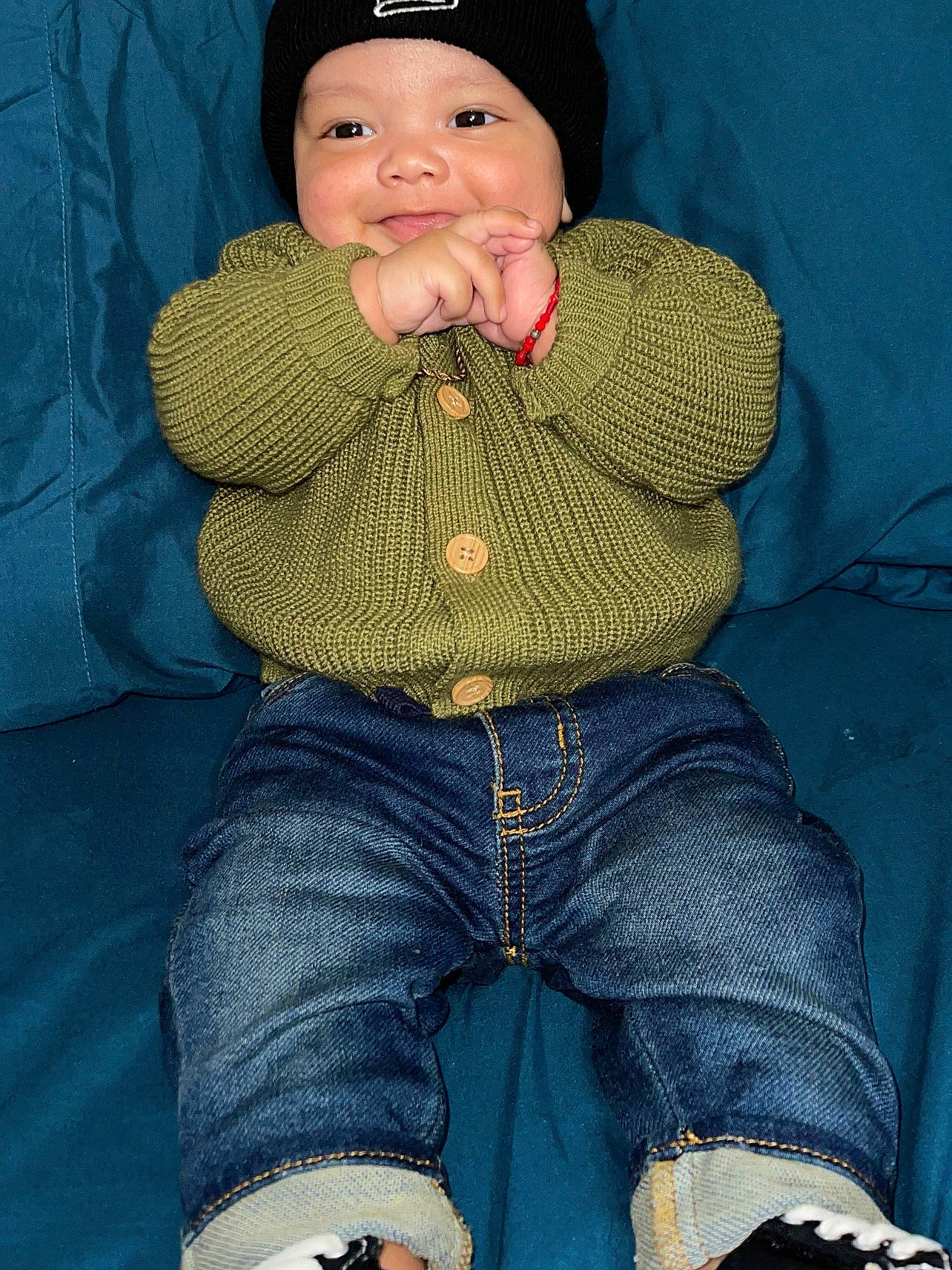 Thiago joined the competition — help win amazing prizes! abdomen, baby, baby_toddler_clothing, blue, cap, clothing, comfort, electric_blue, headwear, human_leg, knee, knit_cap, lap, leg, pattern, person, sitting, sleeve, textile, thigh